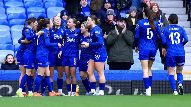 Honoka Hayashi of Everton celebrates scoring her team's first goal with her teammates