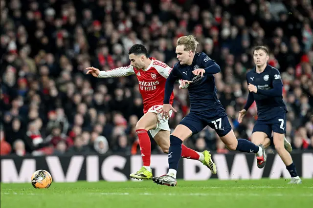Gabriel Martinelli of Arsenal battles for possession with Matt Smith of Wigan Athletic