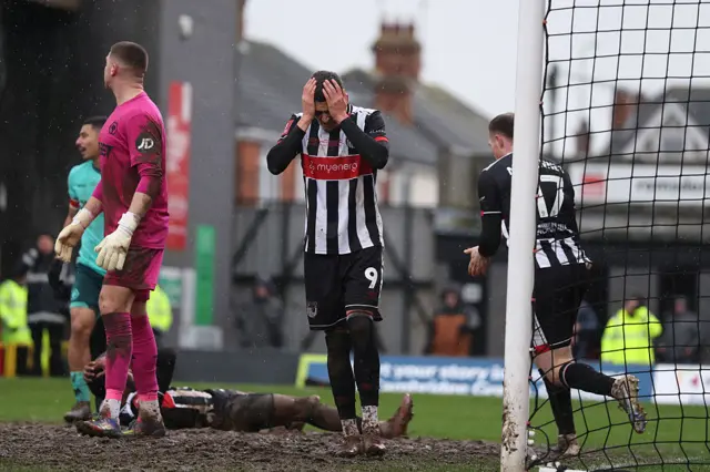 Grimsby's Irish striker #09 Jaze Kabia (C) reacts to a missed chance