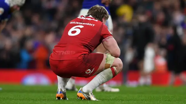 Aaron Wainwright at the final whistle after Wales' defeat to France