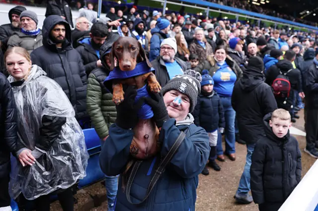 A man with a dog at St Andrews