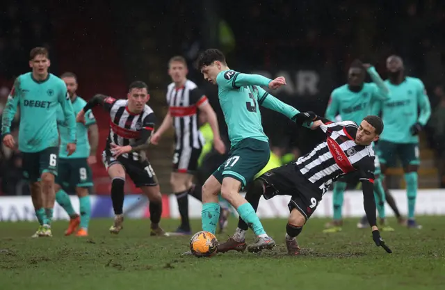 Ladislav Krejci of Wolverhampton Wanderers is challenged by Jaze Kabia of Grimsby Town