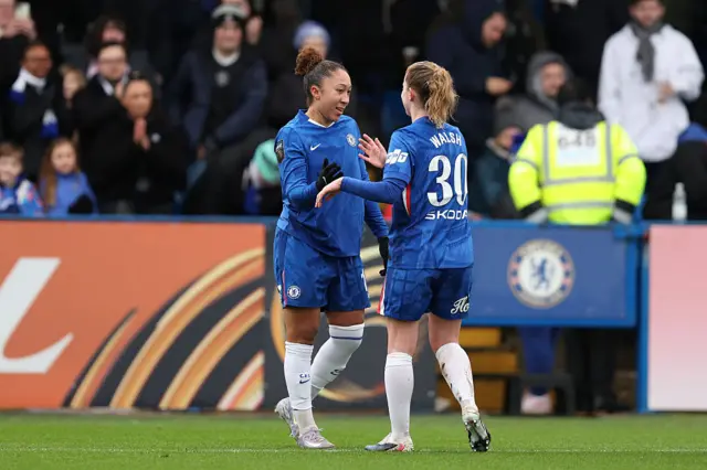 Lauren James of Chelsea celebrates scoring her team's second goal with teammate Keira Walsh