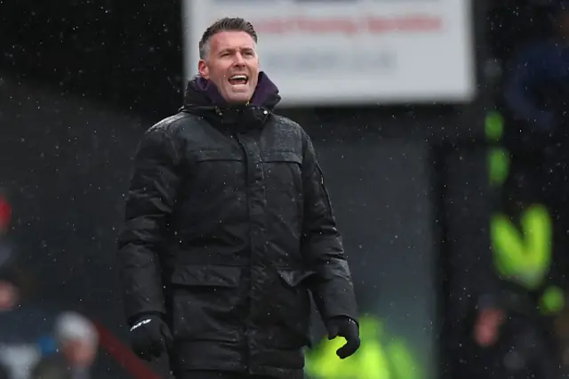Wolverhampton Wanderers' Welsh head coach Rob Edwards gestures on the touchline