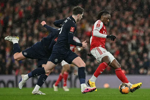 Eberechi Eze (R) controls the ball