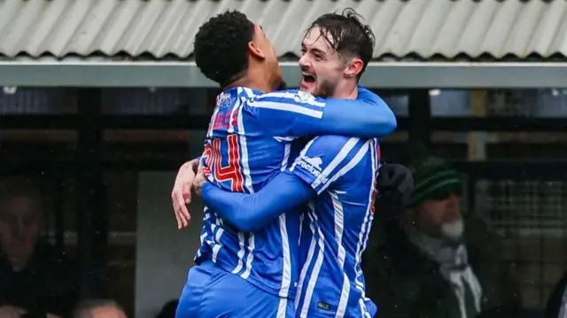 Tyreece John-Jules and Joe Hugill embrace