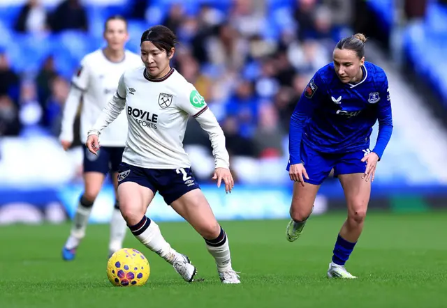 Yu Endo of West Ham United is challenged by Rosa van Gool of Everton
