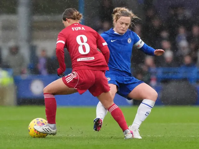 Chelsea's Erin Cuthbert and Liverpool's Fuka Nagano battle for the ball during the Barclays Women's Super League match at Kingsmeadow, London.
