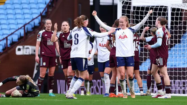 Julie Blakstad of Tottenham Hotspur celebrates scoring her team's seventh goal with teammate Signe Gaupset