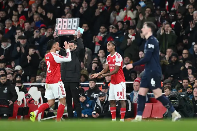 William Saliba of Arsenal high fives teammate Marli Salmon of Arsenal as he prepares to enter the pitch