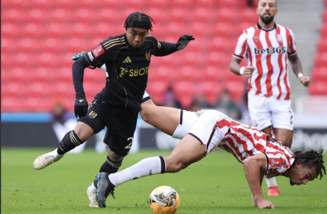 Fulham's Kevin in action with Stoke City's Ashley Phillips