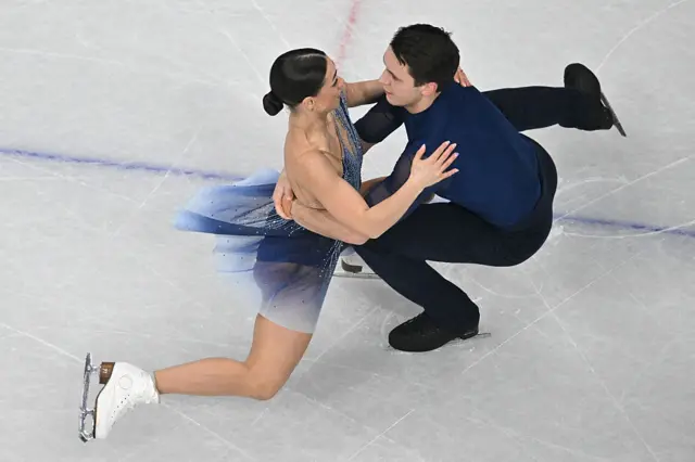 Britain's Anastasia Vaipan-Law and Britain's Luke Digby compete in the kiss and cry area after competing in the figure skating pair skating free skating final during the Milano Cortina 2026 Winter Olympic Games at Milano Ice Skating Arena in Milan