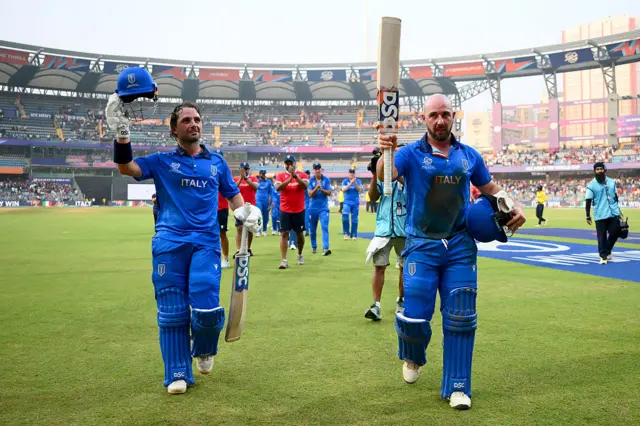 Justin Mosca and Anthony Mosca of Italy acknowledge the crowd as they walk off the field after winning