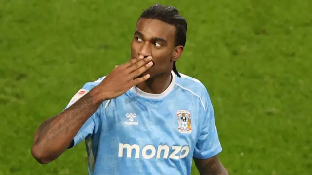 Haji Wright celebrates