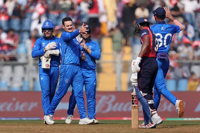 Ben Manenti of Italy celebrates with teammates after dismissing Aasif Sheikh of Nepal