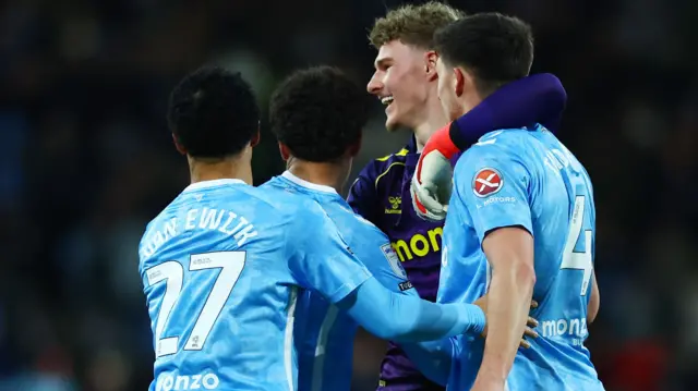 Coventry celebrate scoring with goalkeeper