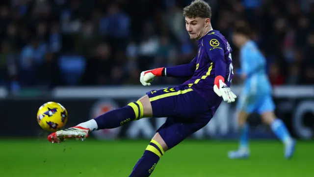 Carl Rushworth kicks the ball