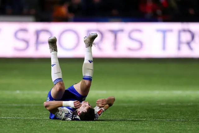 Sam Heathcote of Macclesfield looks dejected after the team's defeat in the Emirates FA Cup Fourth Round match between Macclesfield and Brentford at Moss Rose Ground on February 16, 2026 in Macclesfield, England.