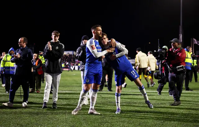 Paul Dawson and Luke Duffy of Macclesfield look dejected after the team's defeat in the Emirates FA Cup Fourth Round match between Macclesfield and Brentford at Moss Rose Ground on February 16, 2026 in Macclesfield, England.