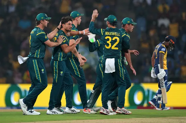 Marcus Stoinis of Australia celebrates taking the wicket of Kusal Janith Perera of Sri Lanka with teammates