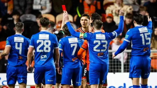 Iurie Iovu is shown a red card