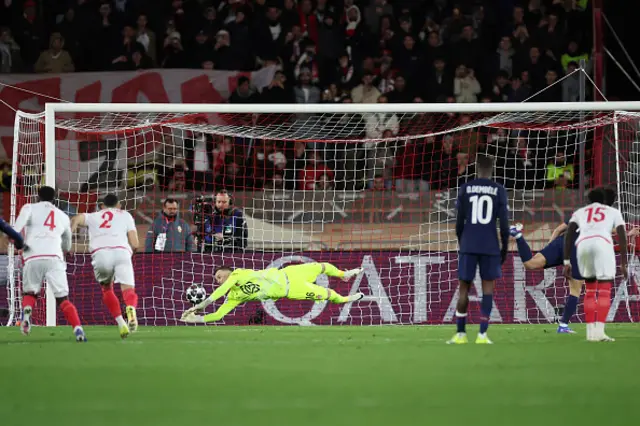 Philipp Kohn (C) stops a penalty