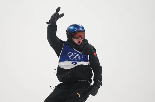 Yuming Su (China) competes during the Big air Snowboard competition