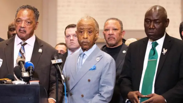 Reverend Al Sharpton (C) and Attorney Ben Crump (R) look on during a press conference following the verdict in the trial of former police officer Derek Chauvin in Minneapolis, Minnesota on April 20, 2021.