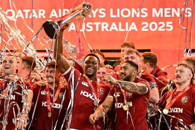 Maro Itoje lifts the Lions trophy after the series win in 2025