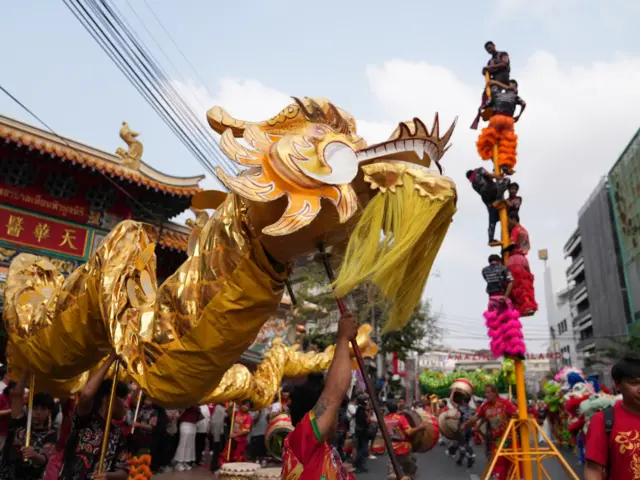 A lion dancer on the street in Bangkok Thailand