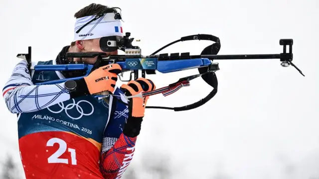 France's Fabien Claude shoots as he warms-up