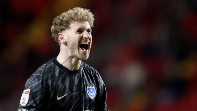 Portsmouth goalkeeper Nicolas Schmid celebrates