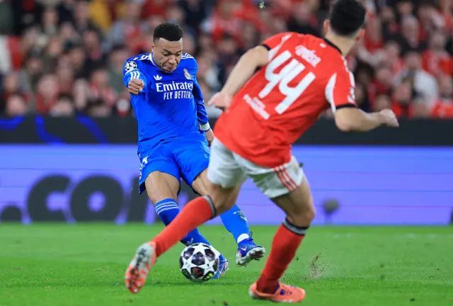 Real Madrid's French forward Kylian Mbappe fights for the ball