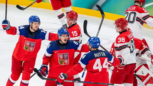 David Kampf #64 of Czechia celebrates his goal with teammates during the Men's Qualification Play-Off match between Czechia and Denmark