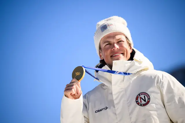 Johannes Klaebo holds his gold medal