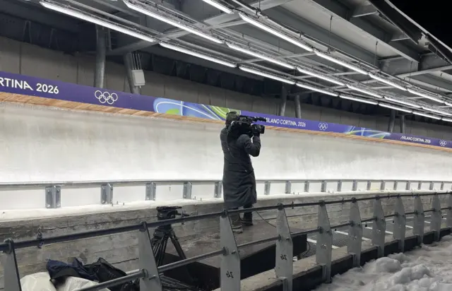 Cameraman at cortina sliding track