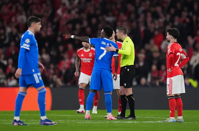 Vinicius Junior of Real Madrid speaks to referee Francois Letexier