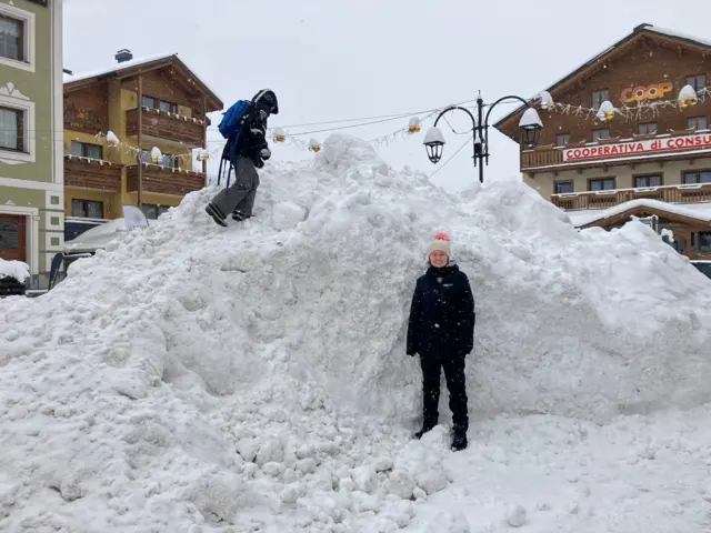 Katie Falkingham stood next to a pile of snow