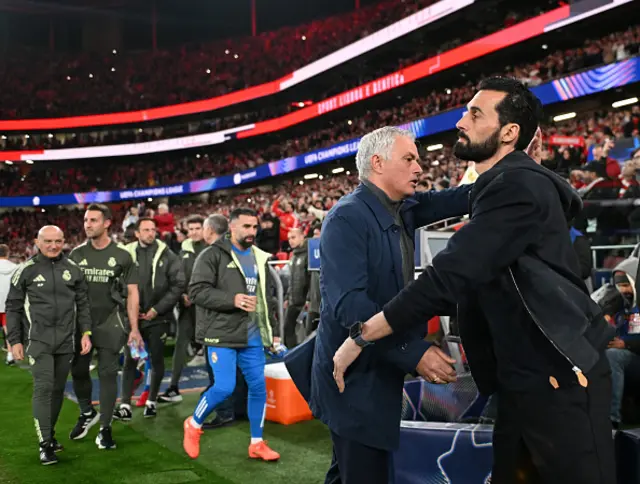Real Madrid manager Alvaro Arbelo and Benfica head coach Jose Mourinho greet each other