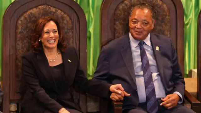 U.S. Vice President Kamala Harris holds hands with Rev. Jesse Jackson during the Rainbow/PUSH Coalition Annual Convention at the Apostolic Church of God in Chicago on July 16, 2023