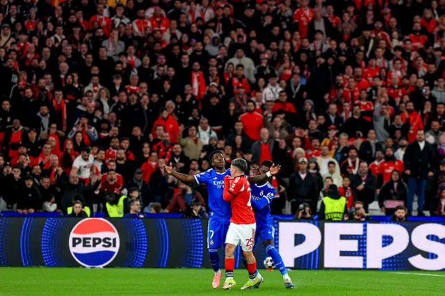 Vinícius Júnior of Real Madrid CF and Gianluca Prestianni of SL Benfica argue