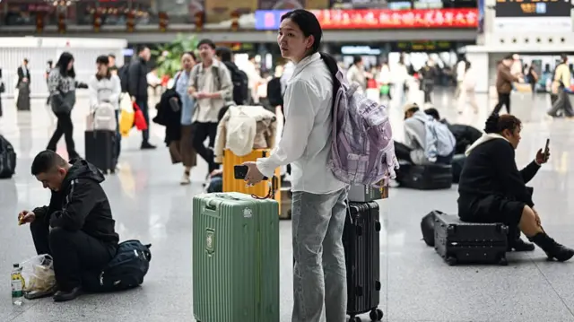 Chinese woman with luggage at the airport
