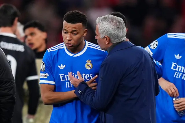 Kylian Mbappe of Real Madrid speaks to Jose Mourinho