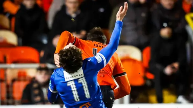 Iurie Iovu fouls Bradley Whyte