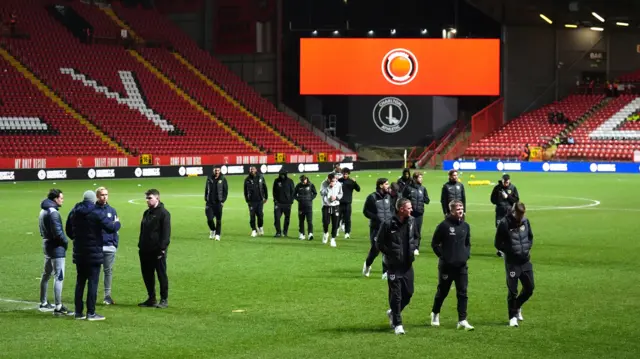 Portsmouth players walking on the pitch at The Valley before kick-off