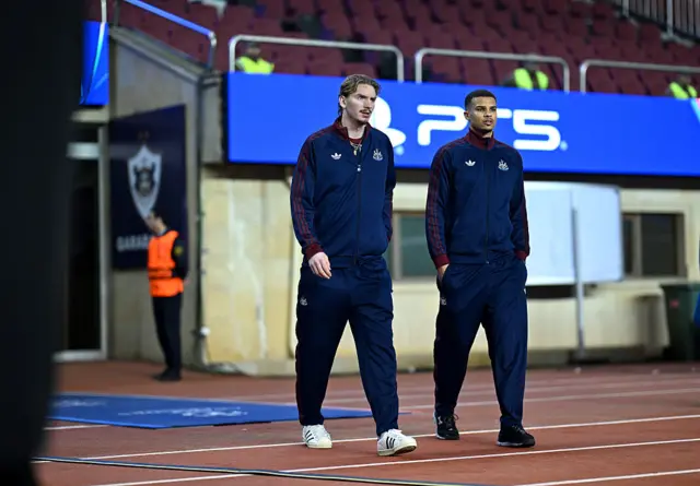 Nick Woltemade and Malick Thiaw of Newcastle United inspect the pitch