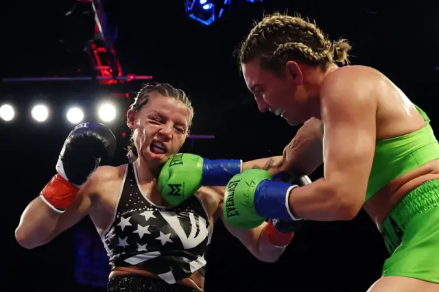 Mikaela Mayer lands a punch on Sandy Ryan's chin