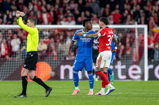Vinicius Junior and the referee crossing his arms