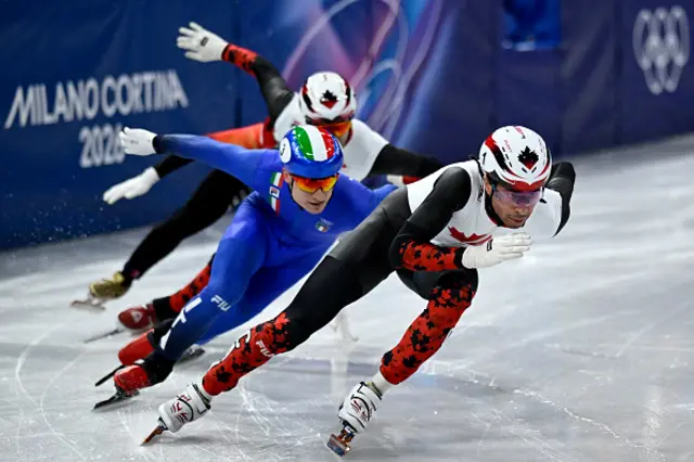 Canada's William Dandjinou and Italy's Pietro Sighel compete in the short track speed skating