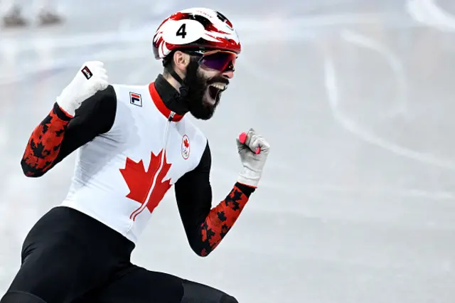Canada's Steven Dubois celebrates after competing for gold